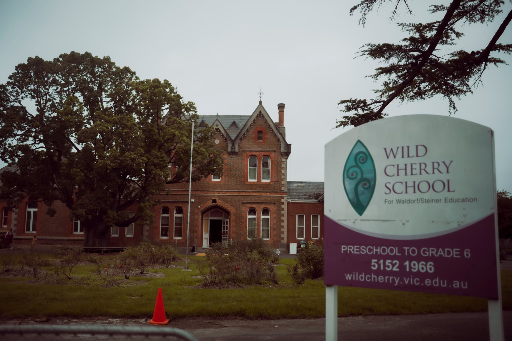 Wild Cherry School exterior with the school sign