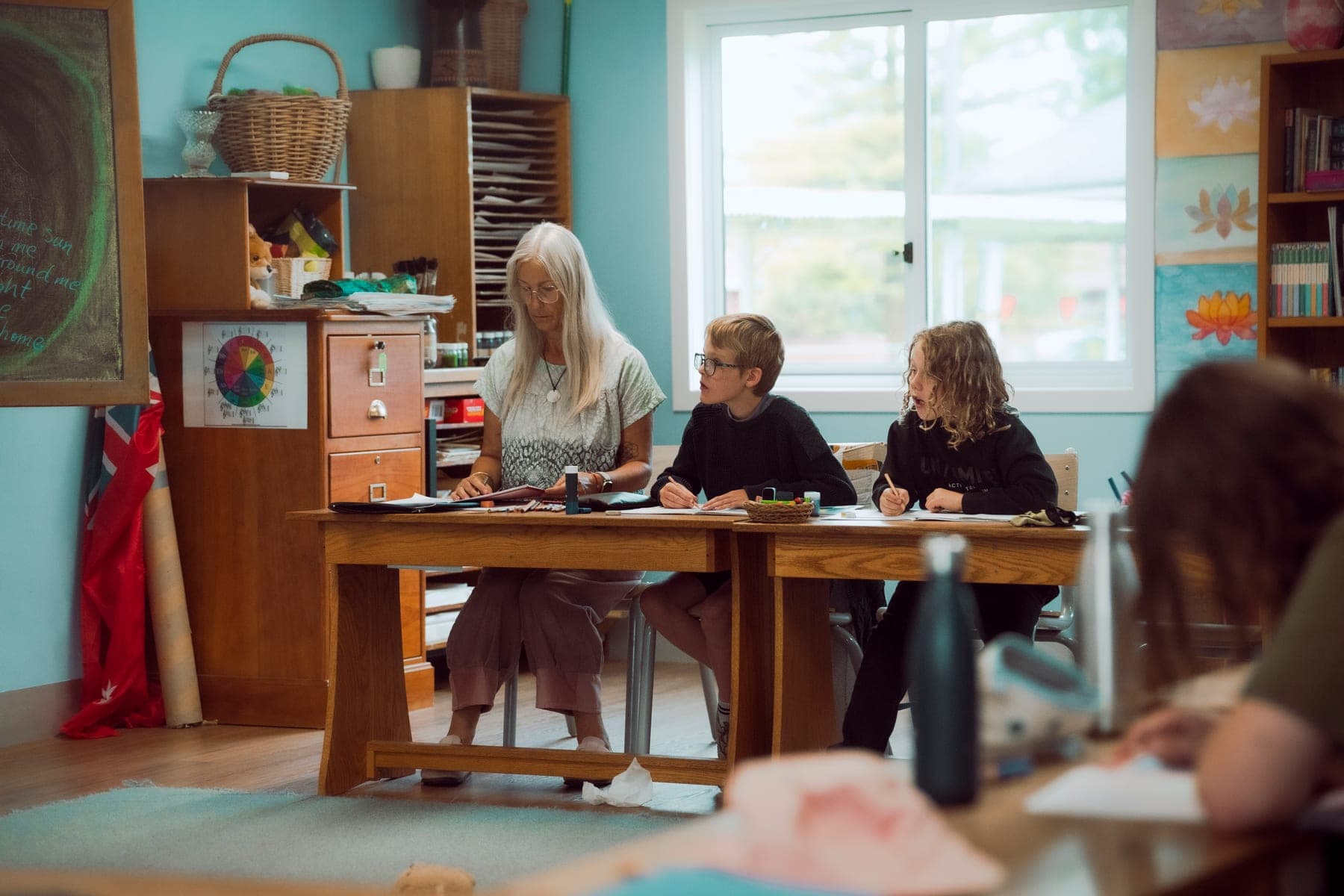 Children engaged in a Steiner classroom lesson