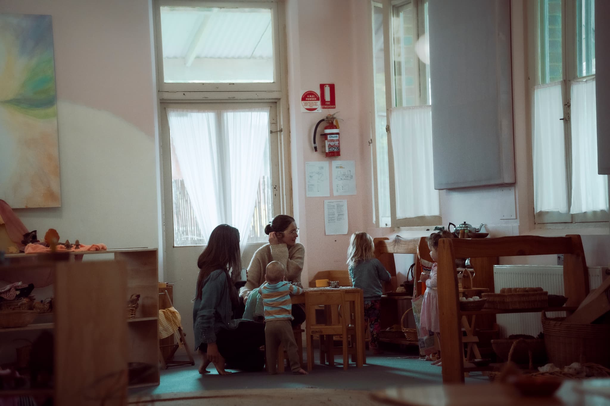 Playgroup parents sharing a moment.