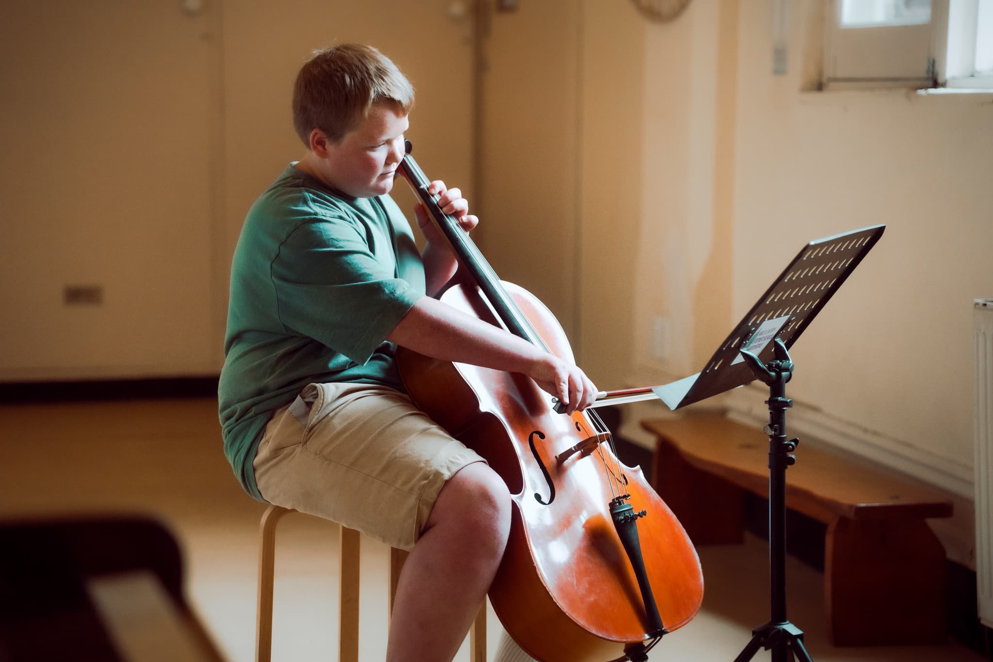 Students playing cello at Wild Cherry School